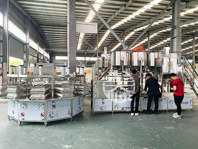 菏澤全自動豆腐機客戶參觀彭大順工廠自動化生產線設